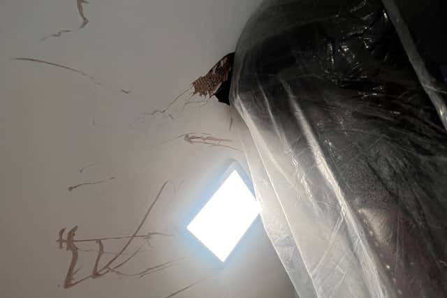 The sofa stuck on the stairs. See SWNS story SWLNsofa. A homeowner has slammed a furniture company after they abandoned a failed attempt to deliver new sofa - leaving it jammed on the stairs. Luke Ansell, 27, had just moved in to his brand new £500k home in Bournemouth in December when he bought an over £2,000 sofa that was delivered on January 19. Despite delivery-men assuring him that they made tight deliveries 'all the time' - the pair from designersofasforyou.co.uk failed to get the new sofa-bed up a narrow staircase, before abandoning it. Photos of the shocking attempted delivery show how the pair left huge holes in the staircase plasterwork, and damage to the woodwork, before leaving.