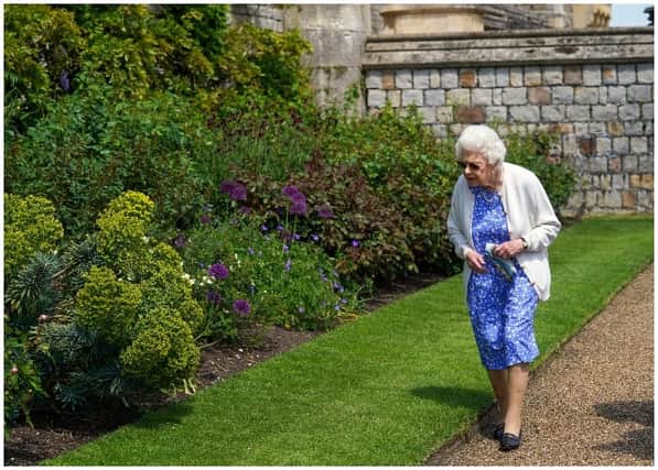Queen Elizabeth II views a border in the gardens of Windsor Castle, where she received a Duke of Edinburgh rose, given to her by the Royal Horticultural Society (Photo by Steve Parsons - WPA Pool/Getty Images)