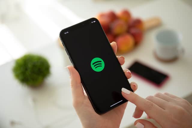 As Spotify is set to raise the price of its single-account premium plan in the UK by £1, customers are desperate to cut the cost of their subscription plans (Credit: Adobe)