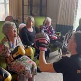 Bailey-Greetham Clark teaches boxing to care home residents.