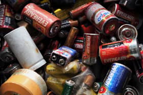 A pile of dead batteries. Photo: Manjunath Kiran/AFP via Getty Images