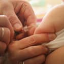 A child is given their MMR vaccination. (Photo: Sean Gallup/Getty Images)