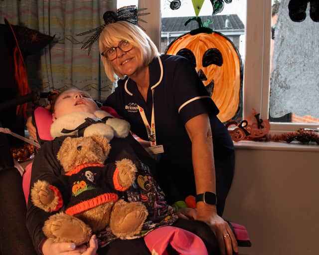 Esme Quinlan-Howarth, 9, with Janet Miller at Brian House Children's Hospice.