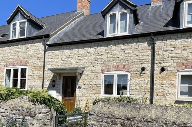 The cottage has countryside views, a private garden and modern kitchen