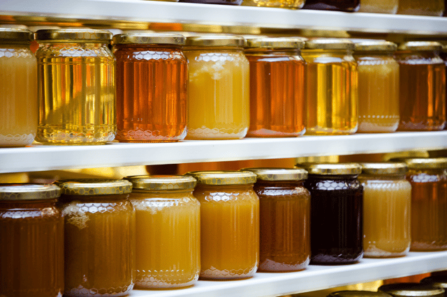 A wide range of honey jars on UK shelves – but nearly half could be adulterated with sugar syrup, according to EU tests