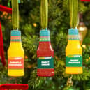 Subway are giving away sauce bottle shaped festive baubles inspired by its most popular sauces - Chipotle Southwest, Sweet Onion, and Honey Mustard.