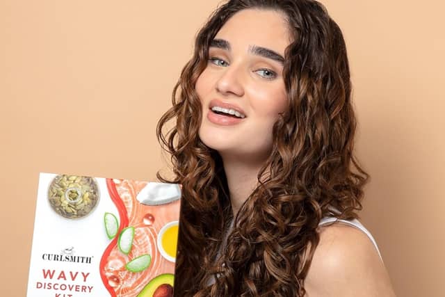 The Curlsmith Discovery Kit includes four premium curl care products designed to cleanse, moisturise, style and refresh curly hair. Photo posed by model.