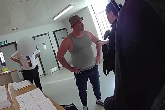 Video grab of the moment Amos Smith who stole almost £15,000 from pensioner was arrested - as he walked out of prison.
