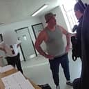 Video grab of the moment Amos Smith who stole almost £15,000 from pensioner was arrested - as he walked out of prison.