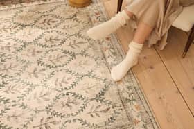 The English Garden rug has a soft recycled-polyester surface and a distressed botanical design. Photo supplied by Hug Rug