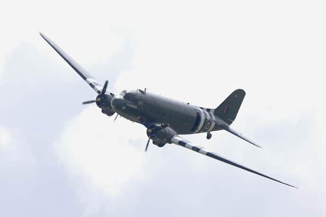 A Dakota flies over Pegasus Bridge (also known as the Bénouville Bridge) during D-Day 70 Commemorations on June 5, 2014 in Ranville, France.