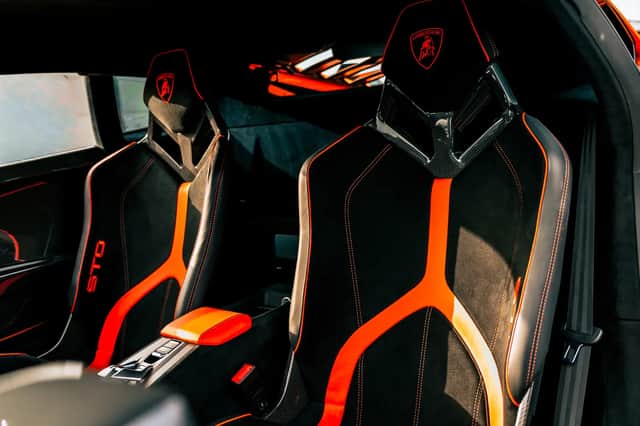 The interior includes carbon-fibre sports seats