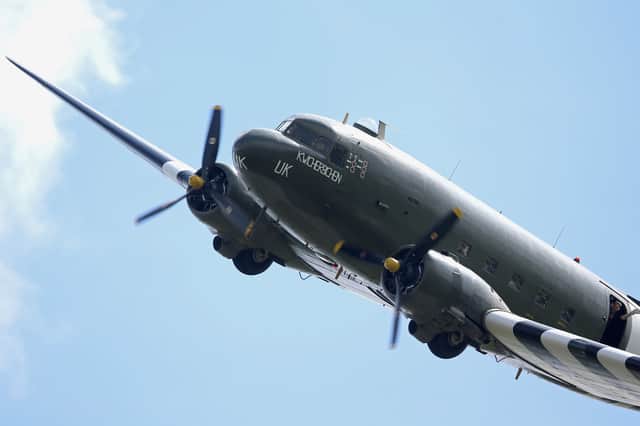 A Dakota flies over Pegasus Bridge (also known as the Bénouville Bridge) during D-Day 70 Commemorations on 5 June 2014 in Ranville, France.