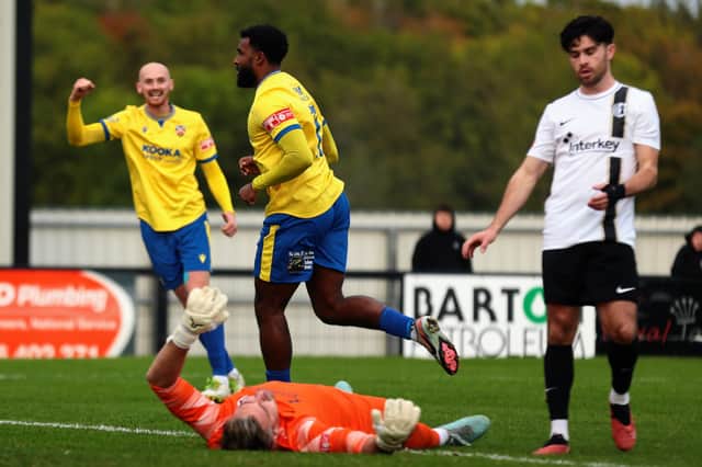 Zayn Hakeem celebrates scoring Wellingborough's third goal in their 4-1 win at Corby Town on Saturday (Picture: Rob Webb)