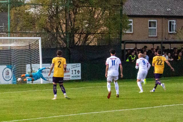 Matty Warburton's winning goal hits the net against Morecambe