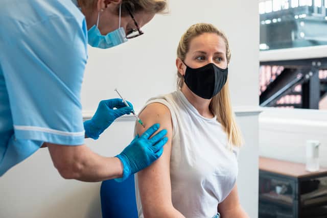 Image of a woman receiving a vaccination