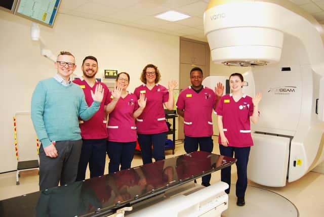 The radiotherapy team with the new Linear Accelerator L-R Mark Cowen, Stephen Fuller, Kayleigh Dawes, Erika Browett, Robson Mango, and Lauren Cox