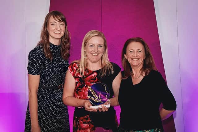 Milly holding her Farming Woman of the Year Award