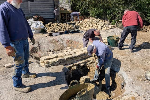 Volunteers and experts start work on the Roman kiln.