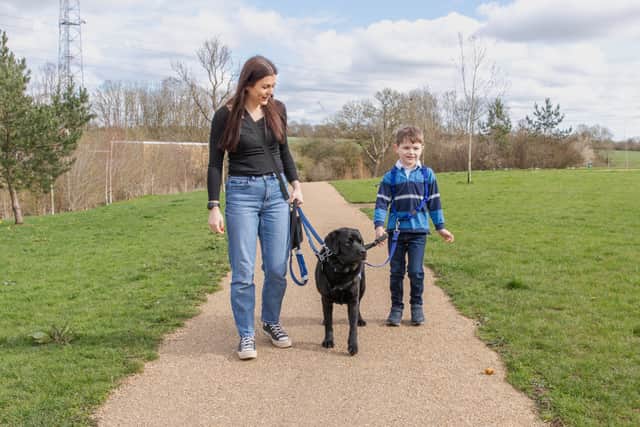 Lucy Rodas with son Carter and support dog Davey