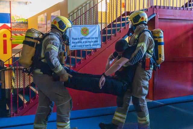 Firefighters carry a 'casualty' during a training exercise at Tigers Indoor Play Kettering