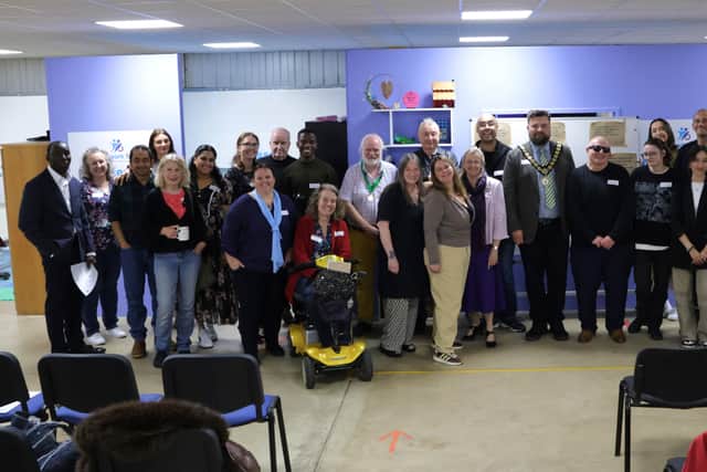 Members and guests celebrate the official charter of NN Clear Speakers at Teamwork Trust, Kettering, alongside Mayor Ben Jameson on his final day in office.