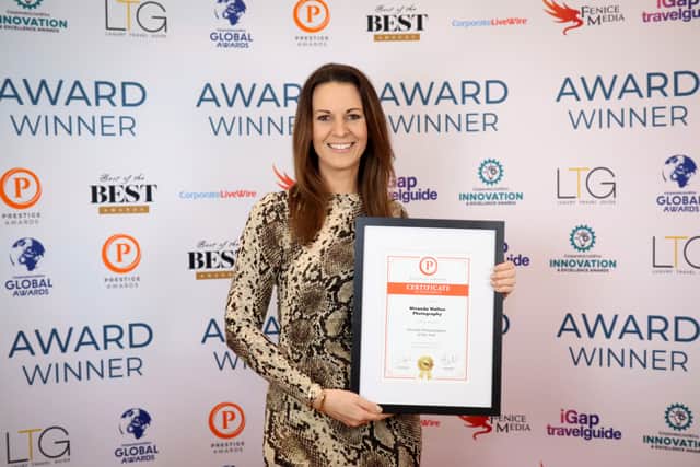 Miranda Walton picking up her award for Portrait Photographer of the Year 2025/26 for Central England at the Prestige Awards