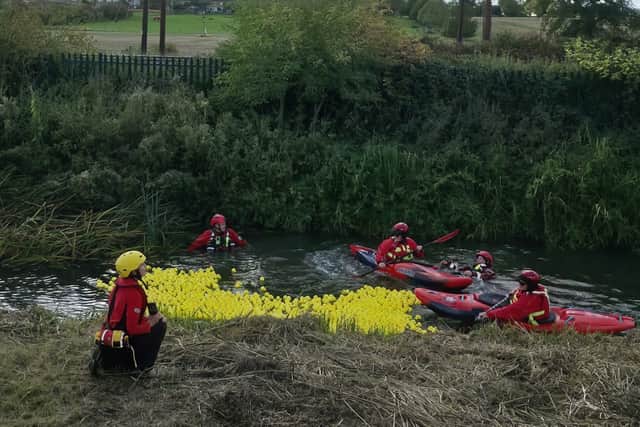 Mountain rescue hearding rubber duckies at the Burton Latimer Duck Race