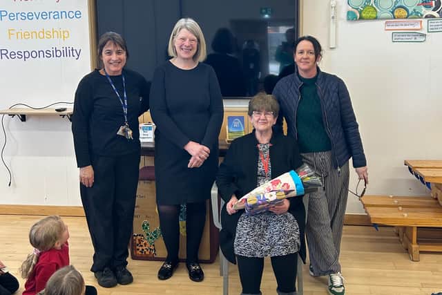Dawn Higgs receives present and praise in honor of her 32 year long commitment to Staverton Primary
