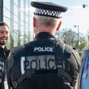 Danielle's ASB Early Intervention workers speak with an officer in the Corby Neighbourhood Policing Team.