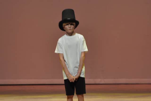 A child actor playing Oliver Twist