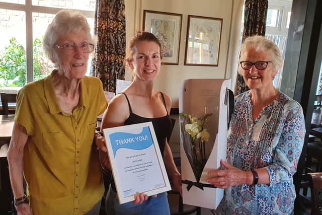 Kate from the Lilacs in Isham, near Kettering is being presented with a thankyou certificate from Sally Wates and Pat Lee , 2 of our founders from 1986, for raising £4000 for Parkinson's UK a couple of years ago.