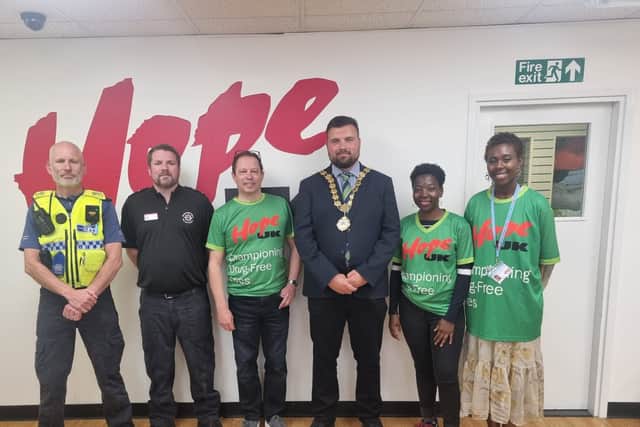 Subrina (right) with Kettering's former mayor, Councillor Ben Jameson and colleagues from Hope UK and local services, at Kettering Junior Citizens 2025, an event for year 6 pupils from local schools.