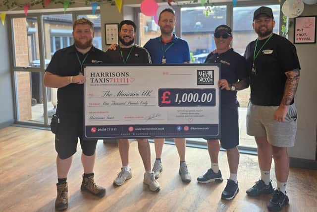 Harrison's Taxis owner Eddie Portelli presents a £1,000 donation to The Man Cave UK following the company's World Cup charity campaign.
