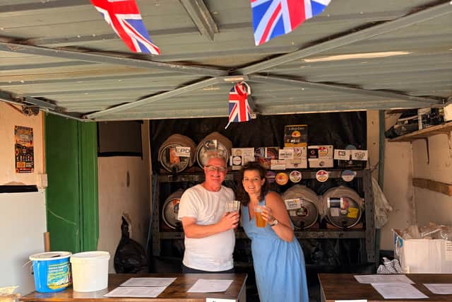 Mark and Lucy volunteering in the barrel shed