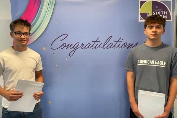 The Corby Sixth Form students Elias (left) and Finlay (right) celebrate after collecting their A Level results.