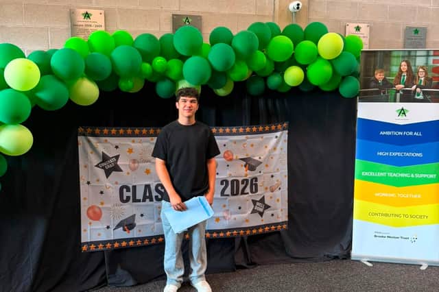Alender McClean collecting his GCSE results at Corby Business Academy this morning