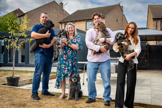 Members of the Esgate Education team who are offering rapid resits to young people who narrowly missed the GCSE results they needed. From left, Chris Esgte-Green, Kerry Esgate-Green, Stephen Esgate-Green and Jessica Purse with therapy dogs
