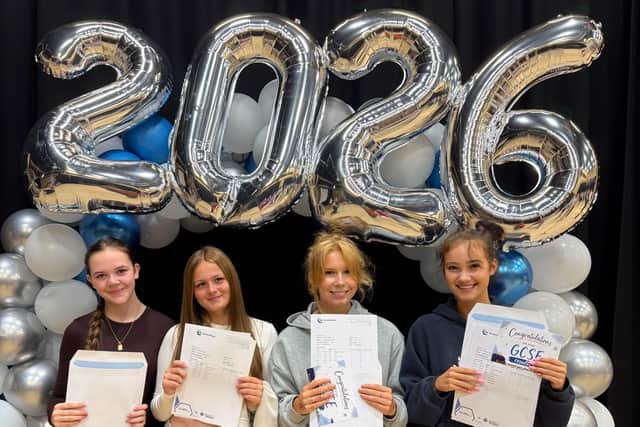 Students at Brooke Weston Academy celebrate receiving their GCSE results today