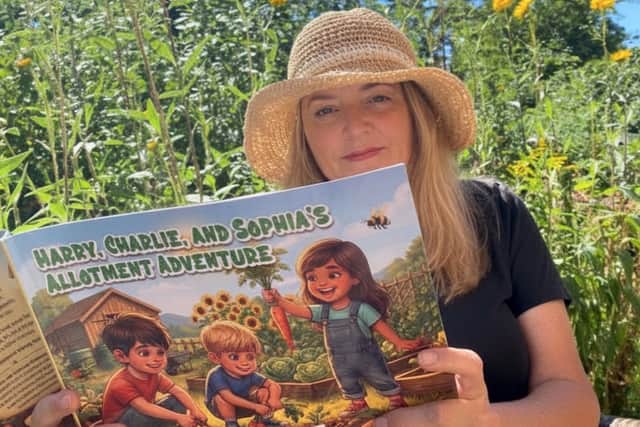 Pictured with the new book is NAS Marketing & PR Officer, Charlotte Watts