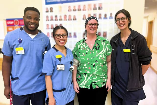 Susan Royse (wearing green) with some of the chemotherapy team who cared for her.