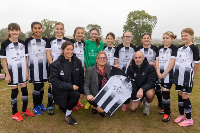 The Harpole girls' football team in their new kits