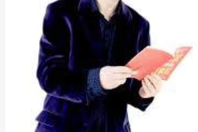 A picture of the Corby based author, George Stanworth, performing at a poetry event