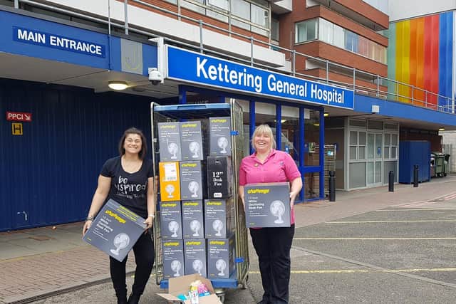 Cristina (left), with Louise, a play specialist on Skylark Ward, who accepted Cristinas donation of 26 fans and toiletries