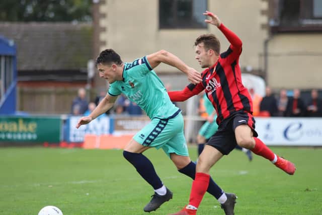 Ben Milnes battles for possession