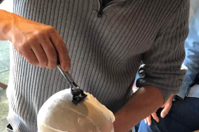 After cutting off all her hair, it was time for a wet shave