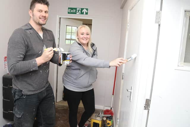 Volunteers from the Co-op painting the halls Adam Paulowski and Lauren Clark
