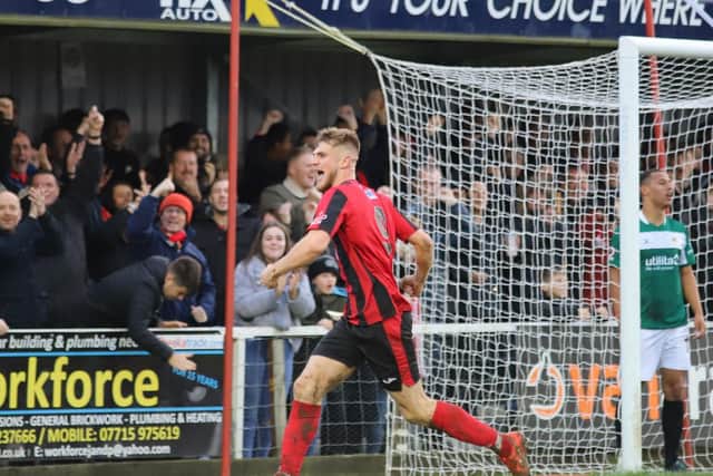 Connor Kennedy heads off to enjoy the moment after he headed home the Poppies' second goal