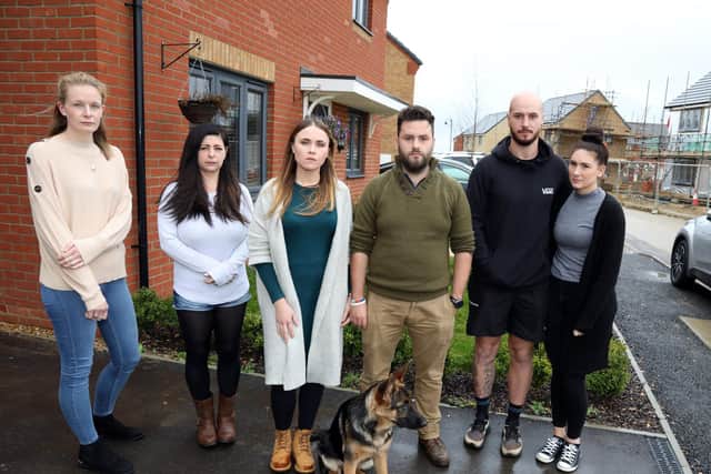 Residents living on Priors Hall Estate in Larkfleet Homes - Merlin Road and Kestrel Road - with hundreds of complaints about the build quality of their homes.
l-r Aimee Fogg (Kestrel Rd), Stacie Smith (Kestrel Road), Natalia Dresler and Liam Underwood with their dogs Athena and Arthur (Merlin Road), Jordan Cuff and Stacey Cuff.