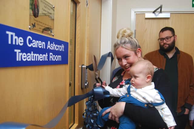 Georgie and Harry cut the ribbon.